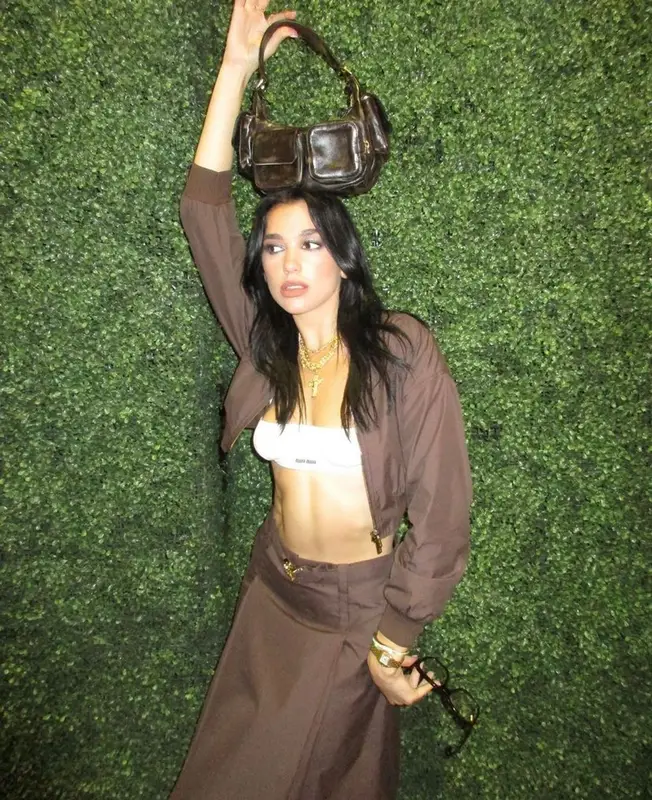Dua Lipa outfit in Miu Miu and Cartier, 2023