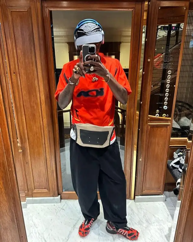 ASAP Nast outfit in Maison Margiela, Stone Island, and Apple, 2023