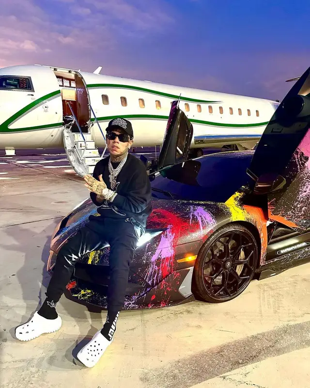 6ix9ine outfit in Palm Angels, Saint Laurent, and Versace, 2023