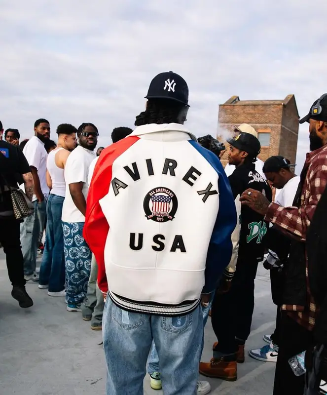 Burna Boy outfit in Avirex, IceCream, and New Era, 2023