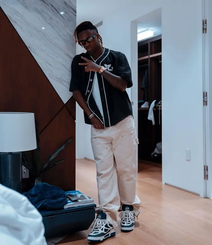 Vinicius Jr outfit in Louis Vuitton and Prada, 2023