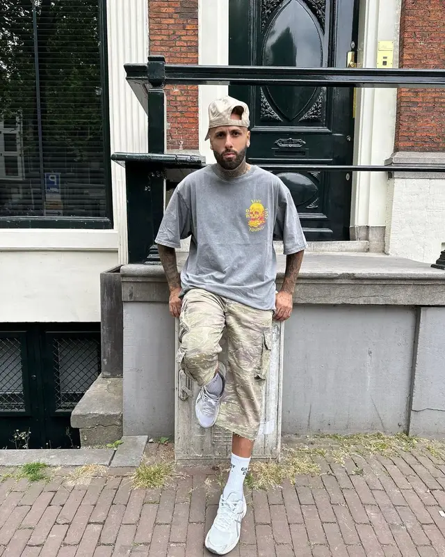 Nicky Jam outfit in John Elliott, Asics, and Gallery Dept., 2023