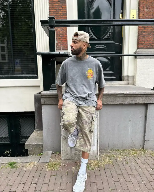 Nicky Jam outfit in John Elliott, Asics, and Gallery Dept., 2023