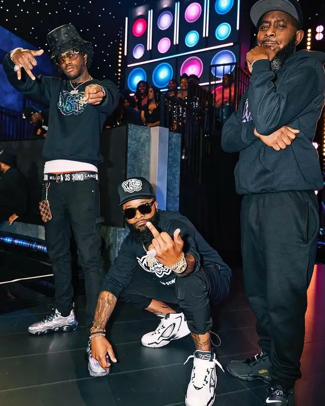 DC YoungFly outfit in Moschino, MCM, and Louis Vuitton, 2023