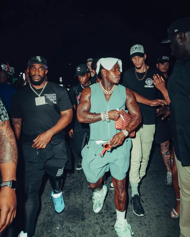 DaBaby outfit in Issey Miyake, Goyard, and Louis Vuitton, 2023