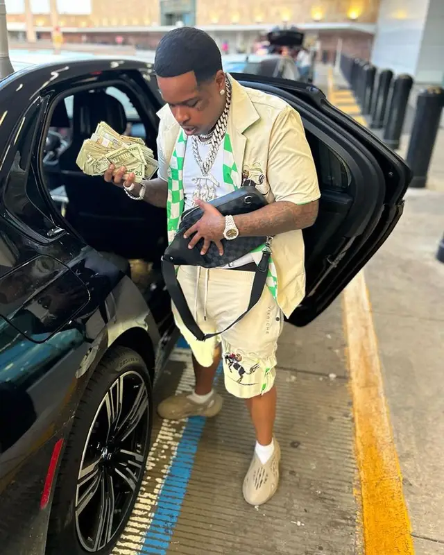 Finesse2tymes outfit in Vieriche, Adidas, and Louis Vuitton, 2023