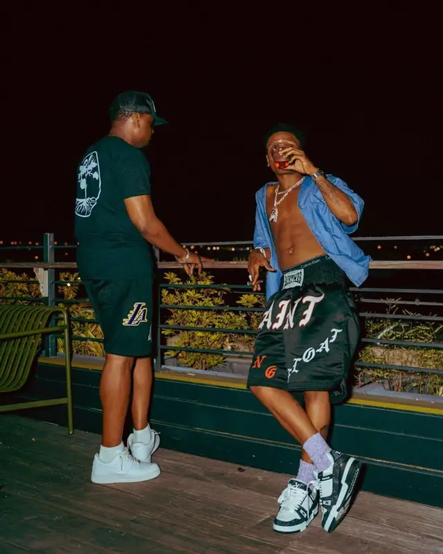 Wizkid outfit in Prada, Saint Michael, and Louis Vuitton, 2023