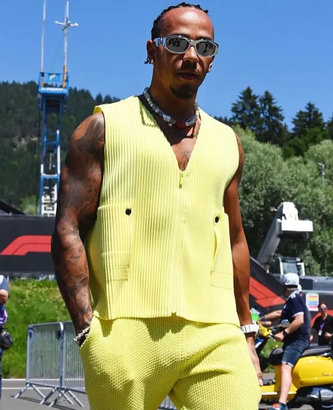 Lewis Hamilton outfit in Issey Miyake, Zegna, and Versace, 2023