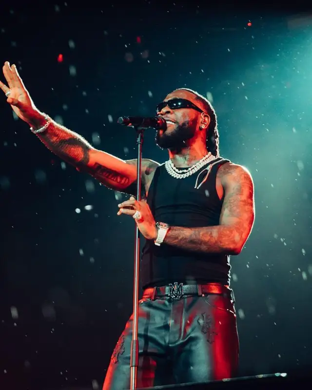Burna Boy outfit in Chrome Hearts, Christian Louboutin, and Amiri, 2023