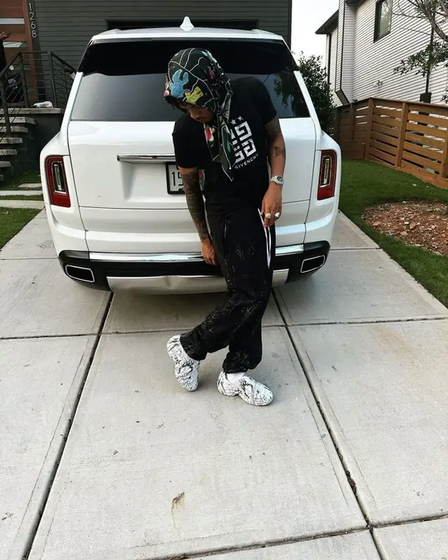 Tekno outfit in Givenchy, Amiri, and Dolce & Gabbana, 2023