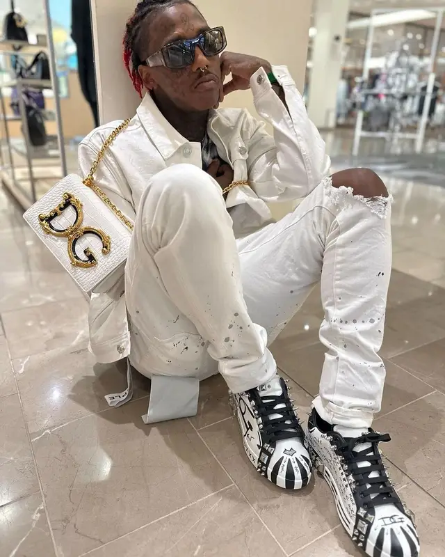 Famous Dex outfit in Purple Brand, Dolce & Gabbana, and Off-White, 2023