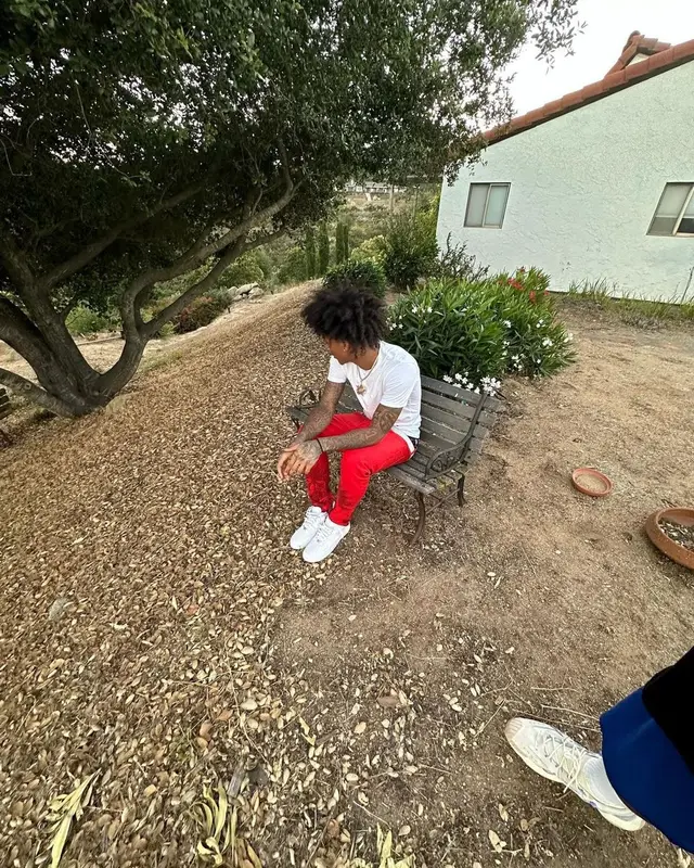 Mikey outfit in Moncler, Polo Ralph Lauren, and Louis Vuitton, 2023