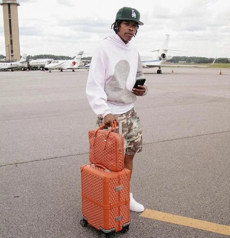 Lil Baby outfit in Dior, New Era, and ERL, 2023