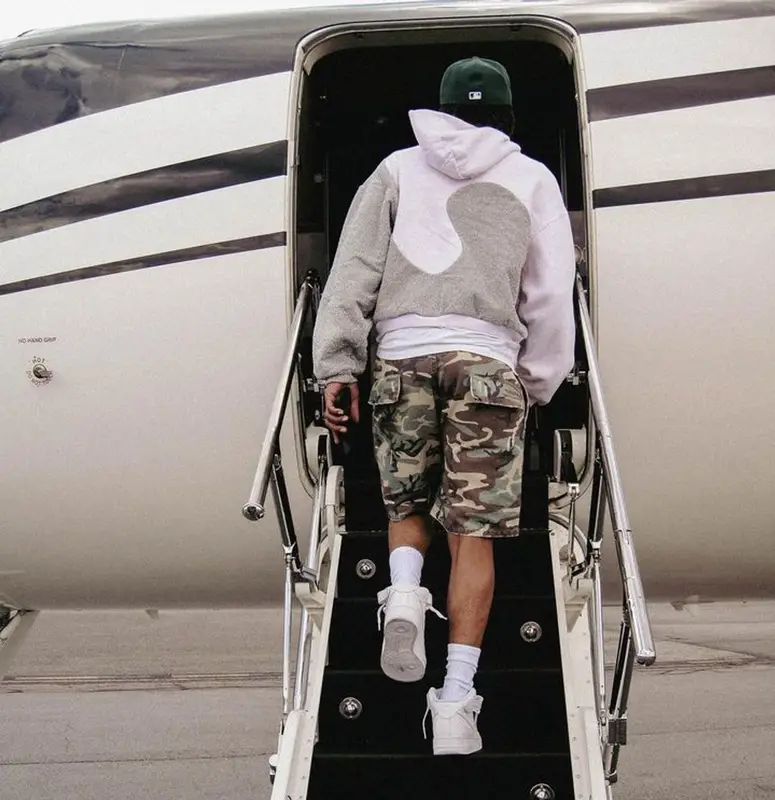 Lil Baby outfit in Dior, New Era, and ERL, 2023