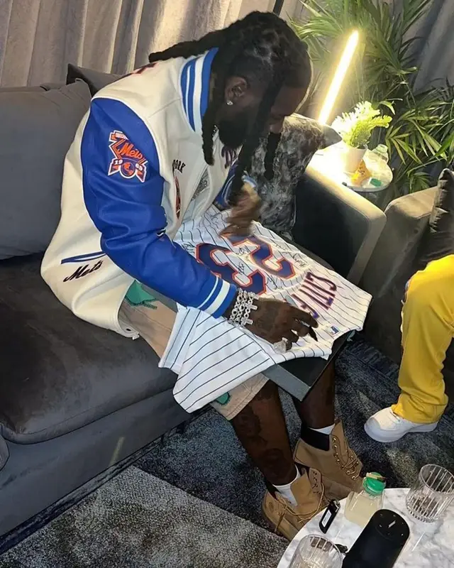 Burna Boy outfit in Who Decides War, Timberland, and New York Mets, 2023