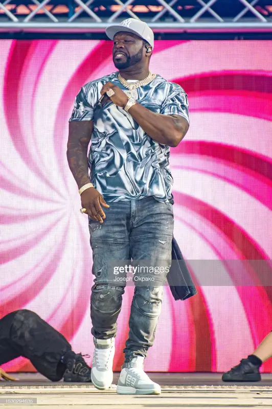 50 Cent outfit in Purple Brand, G-Star RAW, and New Era, 2023