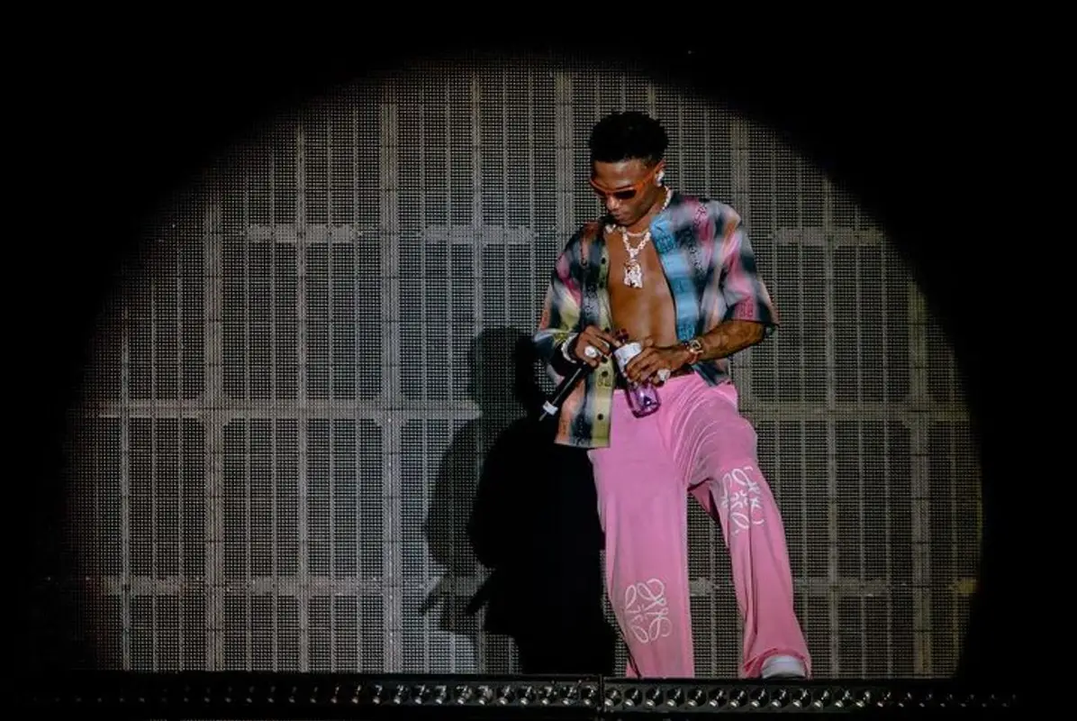 Wizkid outfit in Givenchy, Loewe, and Nike, 2023