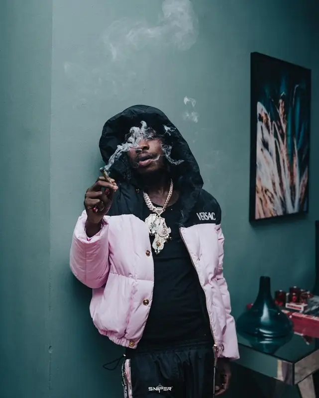 Naira Marley outfit in Versace and Off-White, 2022