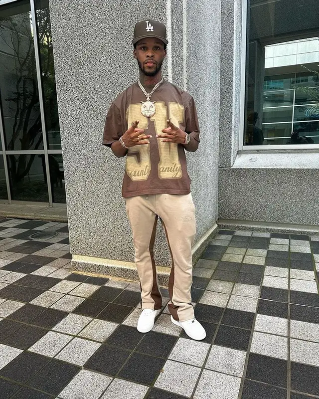 Toosii outfit in Saint Vanity, Nike, and New Era, 2023