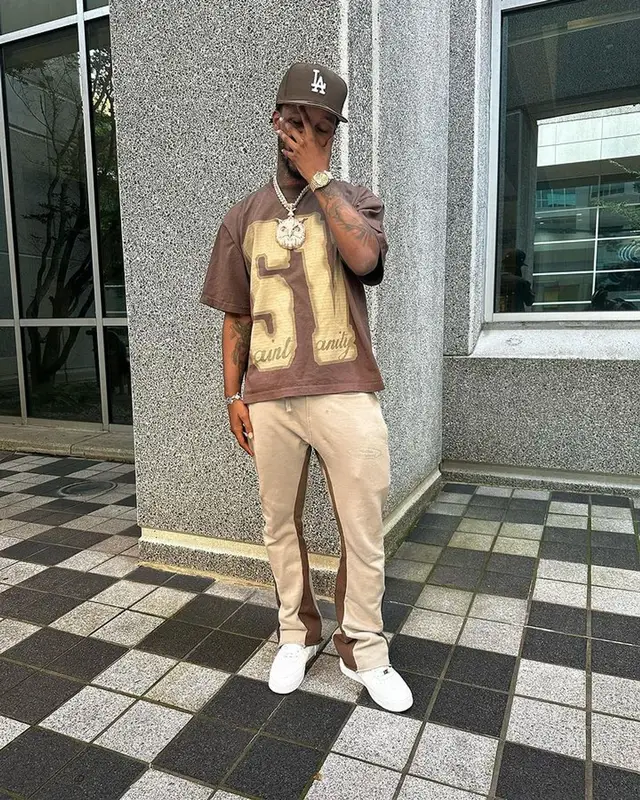 Toosii outfit in Saint Vanity, Nike, and New Era, 2023