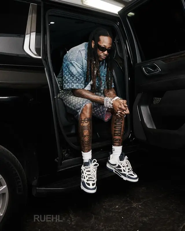 2 Chainz outfit in Louis Vuitton, Balenciaga, and Amiri, 2023