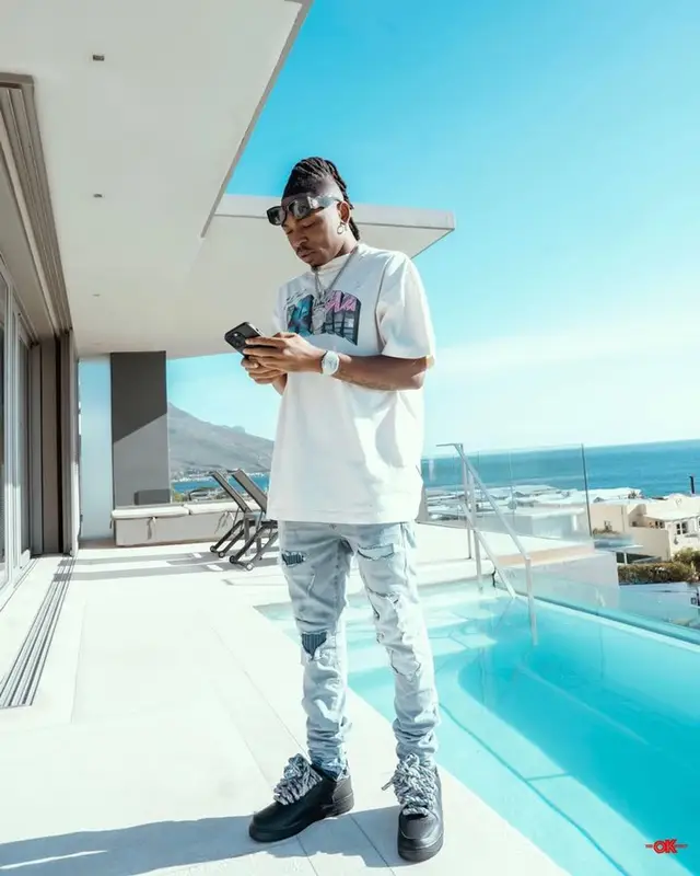 Mayorkun outfit in Palm Angels, Nike, and Casablanca, 2023