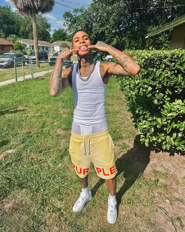 NLE Choppa outfit in Purple Brand, Nike, and Alfani, 2023
