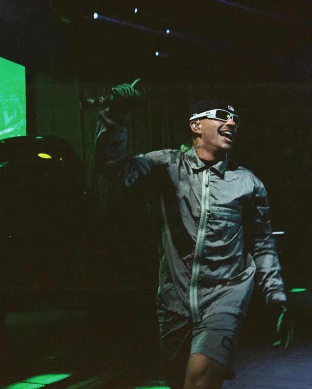 Feid outfit in Stone Island, Oakley, and New Era, 2023