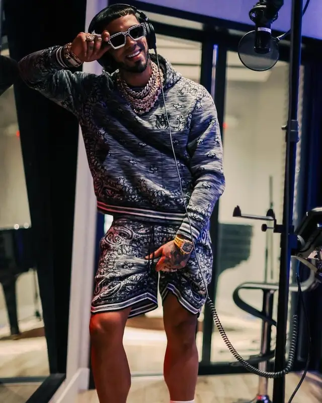 Anuel AA outfit in Amiri, Richard Mille, and Louis Vuitton, 2023