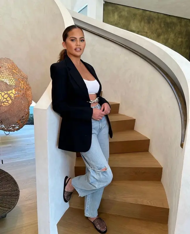 Chrissy Teigen outfit in Christopher Esber, Agolde, and The Row, 2023