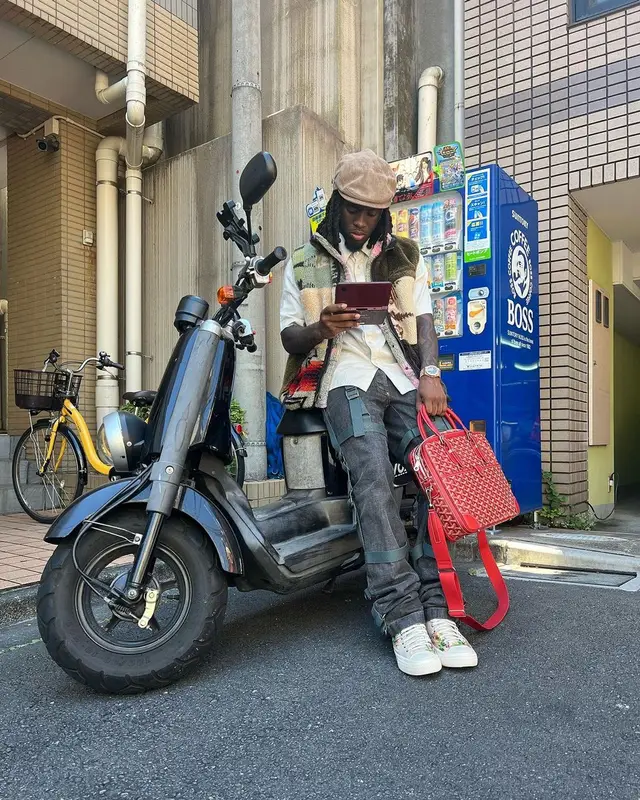 Kai Cenat outfit in Kapital, Dolce & Gabbana, and Goyard, 2023
