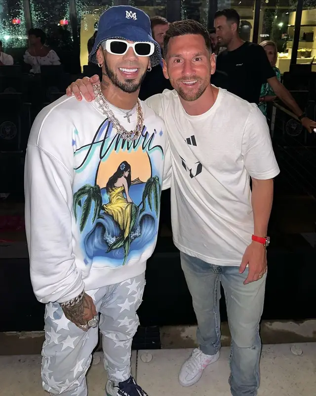 Anuel AA outfit in Chemist, Prada, and Amiri, 2023