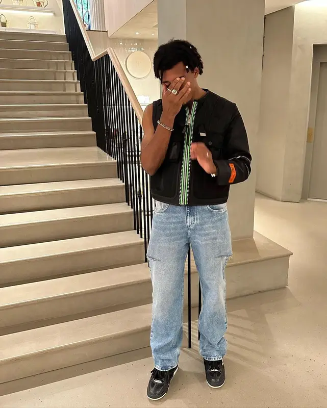 Jules Kounde outfit in Heron Preston, Maison Margiela, and Louis Vuitton, 2023