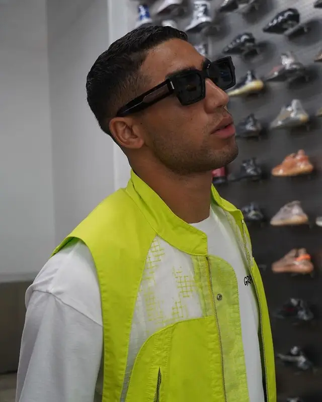 Achraf Hakimi outfit in Stone Island, Ader Error, and Saint Laurent, 2023