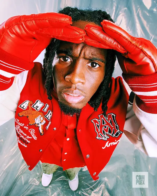 Kai Cenat outfit in Amiri, Acne Studios, and Aime Leon Dore, 2023