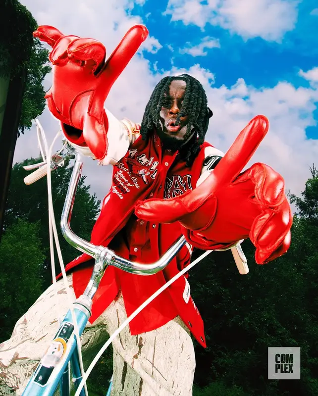 Kai Cenat outfit in Amiri, Acne Studios, and Aime Leon Dore, 2023