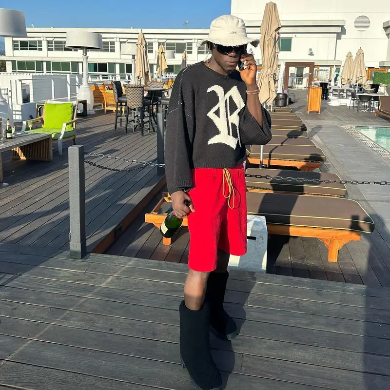 Spinall outfit in Raf Simons, Rhude, and Jacquemus, 2023