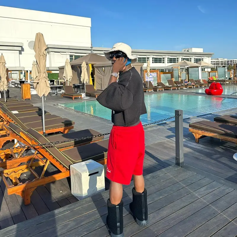 Spinall outfit in Raf Simons, Rhude, and Jacquemus, 2023