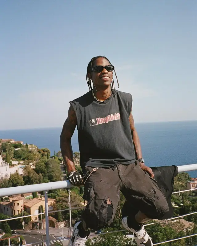 Travis Scott outfit in Saint Laurent, Vintage, and Bottega Veneta, 2023