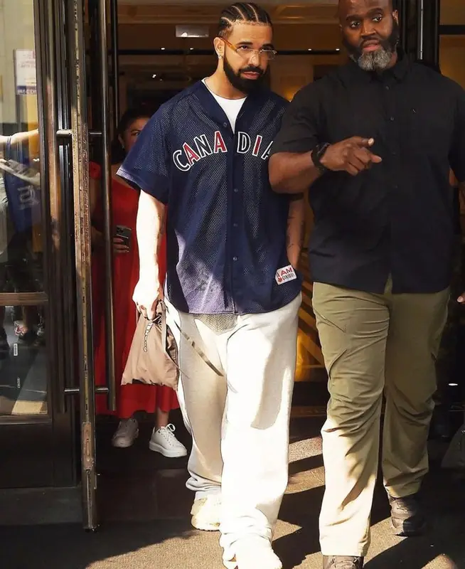 Drake outfit in Molson Canadian, Loewe, and Maybach Eyewear, 2023