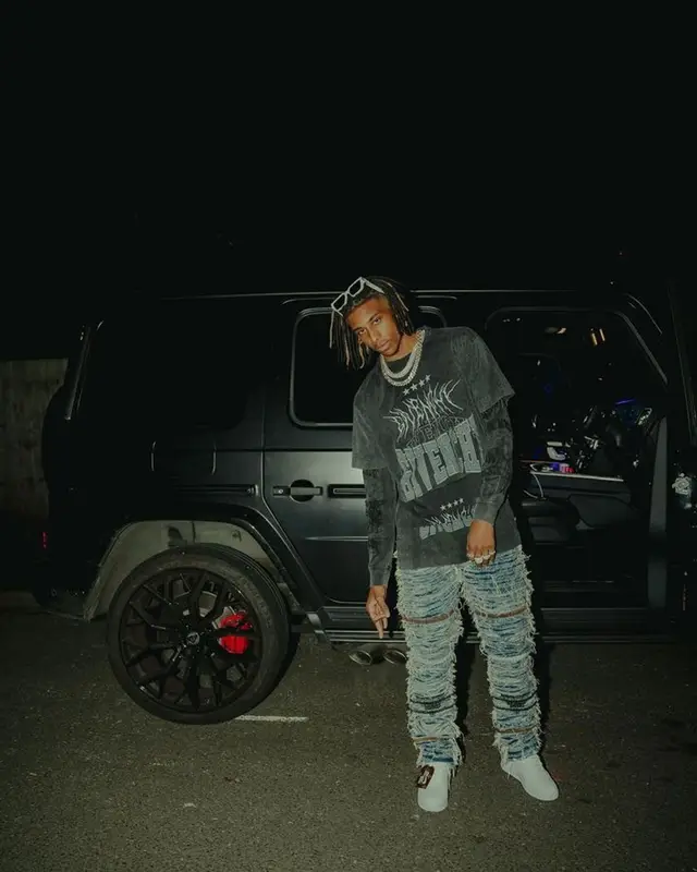 Michael Olise outfit in Givenchy, 1017 Alyx 9SM, and Louis Vuitton, 2022