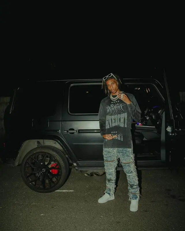 Michael Olise outfit in Givenchy, 1017 Alyx 9SM, and Louis Vuitton, 2022