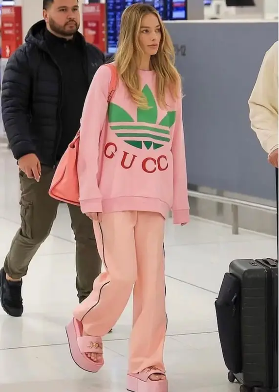 Margot Robbie outfit in Gucci, Chanel, and Adidas, 2023