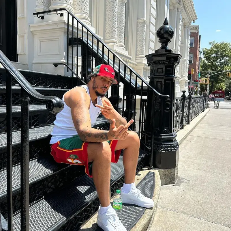 AJ Tracey outfit in Peso, Mitchell & Ness, and Nike, 2023
