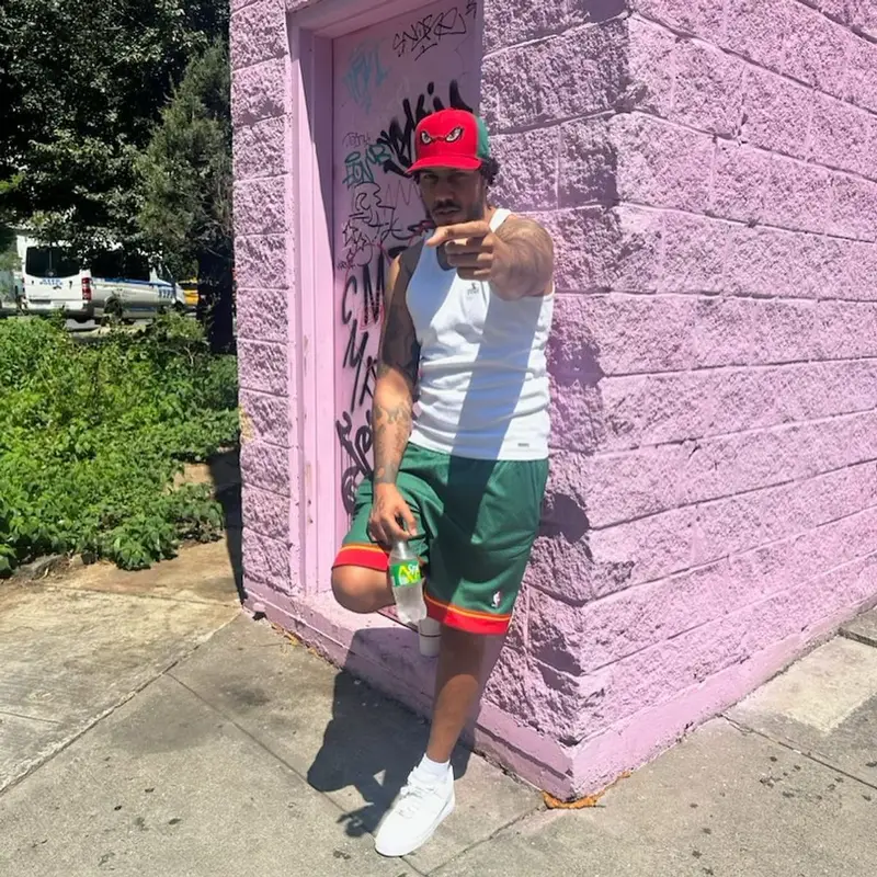 AJ Tracey outfit in Peso, Mitchell & Ness, and Nike, 2023