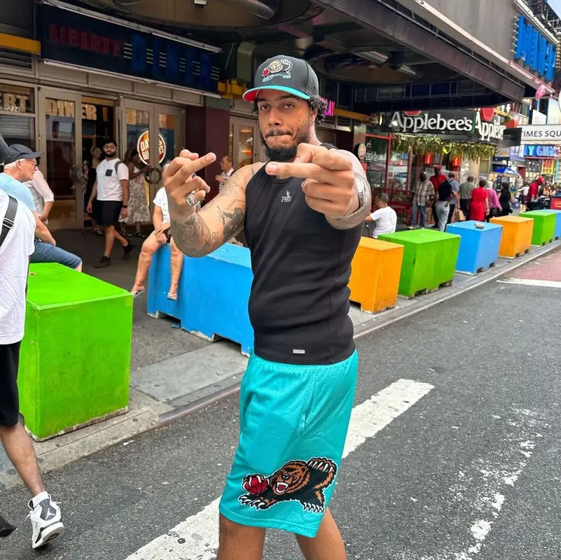 AJ Tracey outfit in Peso, Nike, and Mitchell & Ness, 2023