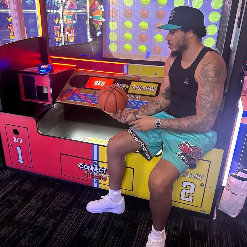 AJ Tracey outfit in Peso, Nike, and Mitchell & Ness, 2023