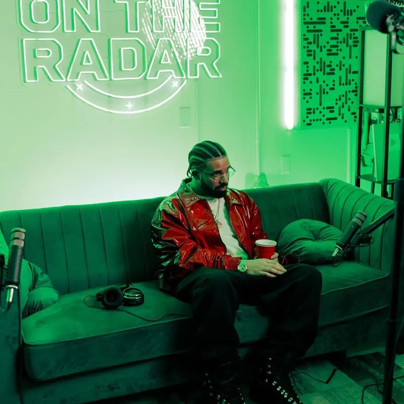 Drake outfit in Bottega Veneta, Heliot Emil, and Maybach Eyewear, 2023