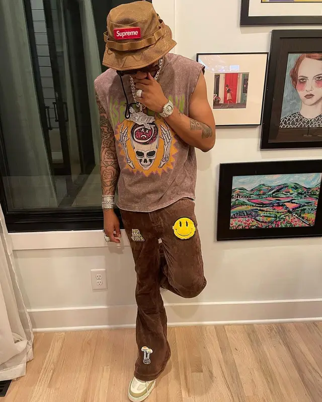 Lil Migo outfit in Louis Vuitton, Off-White, and Supreme, 2023