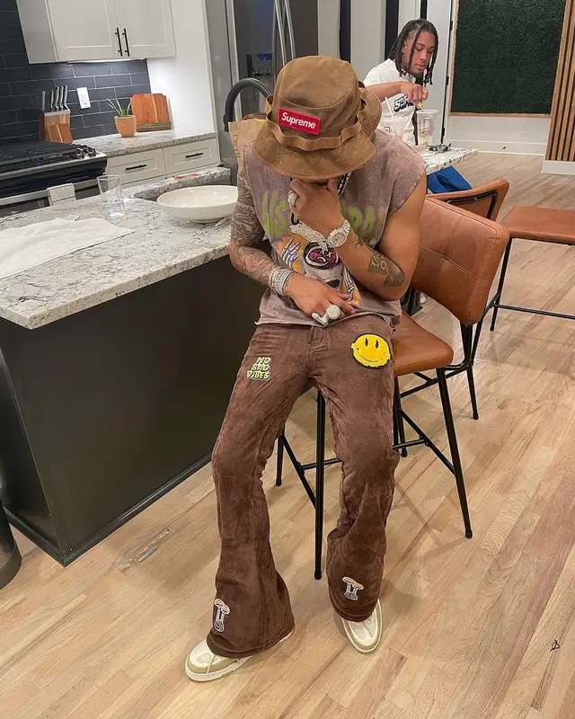 Lil Migo outfit in Louis Vuitton, Off-White, and Supreme, 2023